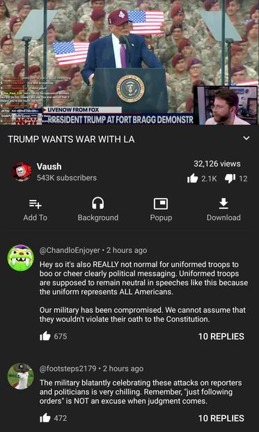 Screenshot of a video of trump being cheered by soldiers at fort Bragg. The comments are pointing out his bad of a sign that is.