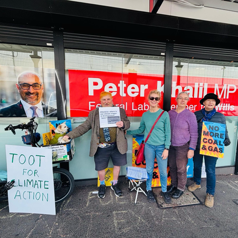 Humans and us chihuahuas standing outside an MP office
