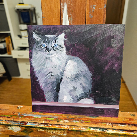 A small square painting of a long hair white and black cat with bluegreen eyes. Cat is sitting looking right at the viewer in a window sill. Magenta under color showing through