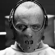 A restrained, and physically, and I guess socially, masked black and white image of Hannibal Lecter.