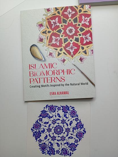 The same pattern from picture 1, beneath a book called 'Islamic Biomorphic Patterns: Creating Motifs Inspired by the Natural World', by Esra Almahal.