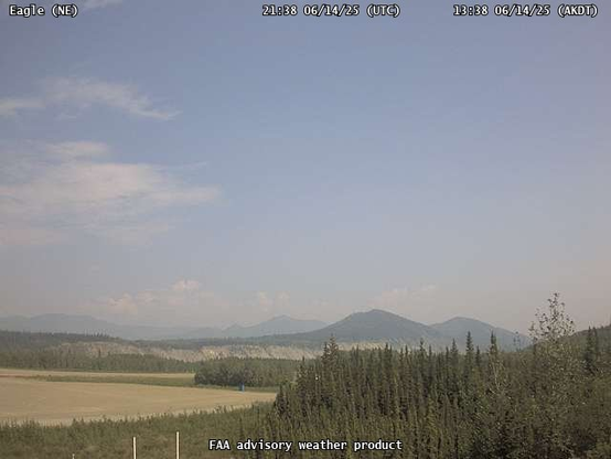 FAA webcam at the Eagle, Alaska airport at 138pm AKDT looking northeast and showing hazy conditions from smoke.