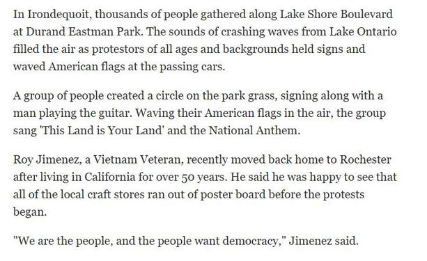 An excerpt from the Rochester NY Democrat and Chronicle article about the June 14 2025 No Kings rally. The article covered five locations around the county. This excerpt describes the rally in the town of Irondequoit.

"In Irondequoit [NY], thousands of people gathered along Lake Shore Boulevard at Durand Eastman Park. The sounds of crashing waves from Lake Ontario filled the air as protestors of all ages and backgrounds held signs and ‘waved American flags at the passing cars.

"A group of people created a circle on the park grass, singing along with a man playing the guitar. Waving their American flags in the air, the group sang 'This Land is Your Land' and the National Anthem.

"Roy Jimenez, a Vietnam Veteran, recently moved back home to Rochester after living in California for over 50 years. He said he was happy to see that all of the local craft stores ran out of poster board before the protests began.

"We are the people, and the people want democracy,” Jimenez said.