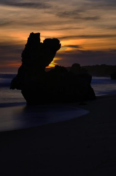 Rabbit Rock, affectionately dubbed "Bunny Rock," is a whimsical natural formation nestled along Montforts Beach in Blairgowrie, part of Victoria’s Mornington Peninsula National Park. This coastal gem is renowned for its striking resemblance to a rabbit, complete with prominent "ears," making it a favorite among photographers and hikers alike. Accessible via the Rabbit Rock Circuit—a moderately challenging 5.1 km loop that meanders through coastal scrub, grasslands, and woodlands—the trail offers scenic vistas and a chance to explore the beach's unique geological features. Visitors are advised to check tide times before setting out, as low tide reveals tidal rock pools and ensures safer passage along the shoreline. The beach itself, characterized by golden sands and dramatic calcarenite bluffs, provides a serene backdrop for this quirky landmark, offering a delightful blend of natural beauty and coastal charm.