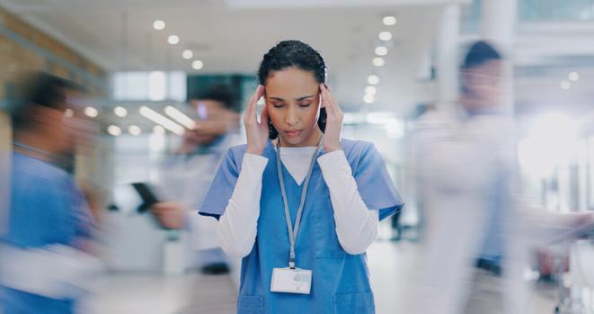 Nurse Looks Stressed At Work