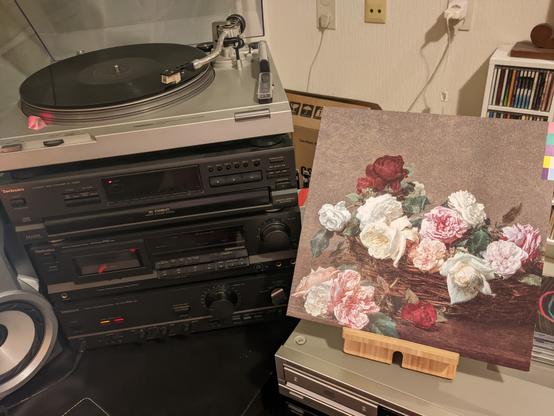 The album on display and the vinyl record on the player.