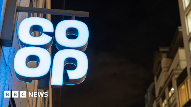 Co-op sign lit up at night in London