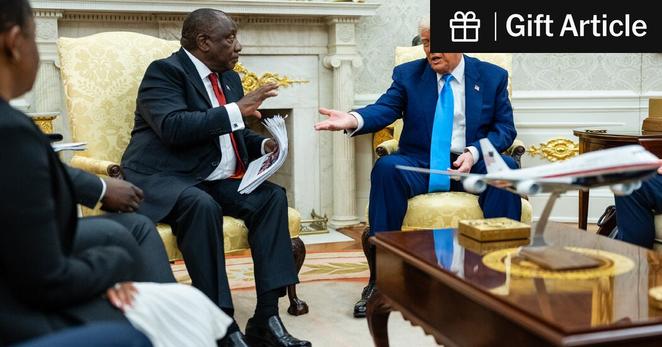 President Trump gestured toward a stack of papers during a tense meeting with President Cyril Ramaphosa on Wednesday in the Oval Office.