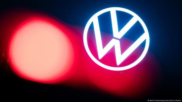 Volkswagen logo and red light in Wolfsburg on February 5, 2025