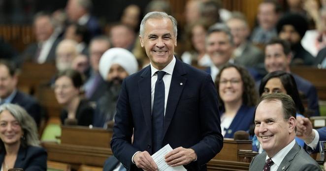 Prime Minister Mark Carney smiles as he rises for the first time in the House of Commons following the election of the Speaker on Monday, May 26, 2025 in Ottawa. THE CANADIAN PRESS/Adrian Wyld
