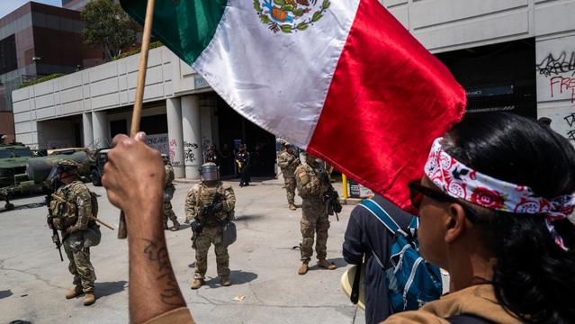 LOS ANGELES, CALIFORNIA - JUNE 08: Protesters stand off with National Guard soldiers and police outside the Metropolitan Detention Center, MDC on June 08, 2025 in Los Angeles, California. Tensions in the city remain high after the Trump administration called in the National Guard against the wishes of city leaders following two days of clashes with police during a series of immigration raids. More protests are scheduled for today. (Photo by Spencer Platt/Getty Images)