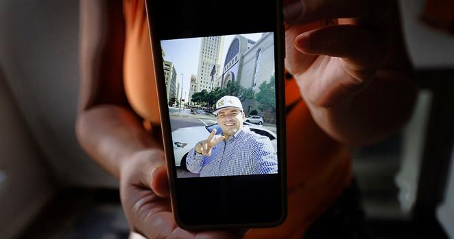 Patricio Galera’s wife shows his photo to The Dallas Morning News during an interview in her apartment, Thursday, June 5, 2025, in Dallas. Galera is detained in the Prairieland Detention Center in Alvarado, Texas.