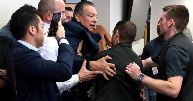 Los Angeles, CA. June 12, 2025 - Senator Alex Padilla is removed from the room after interrupting a news conference with Department of Homeland Security Secretary Kristi Noem at the Wilshire Federal Building in Los Angeles on June 12, 2025.