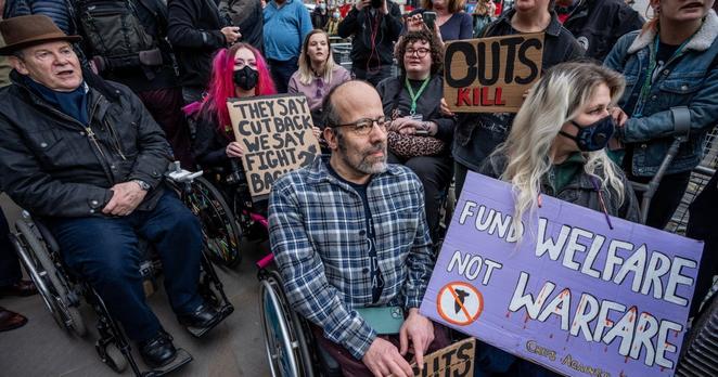 Disability rights activists gather to protest against cuts to social security outside Downing Street, London, UK, March 26, 2025.
