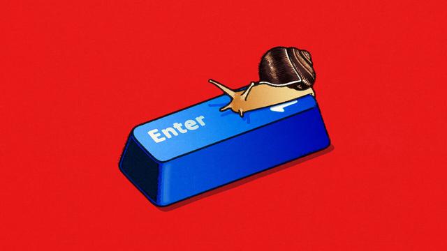 A small snail resting on the 'Enter' key of a computer keyboard