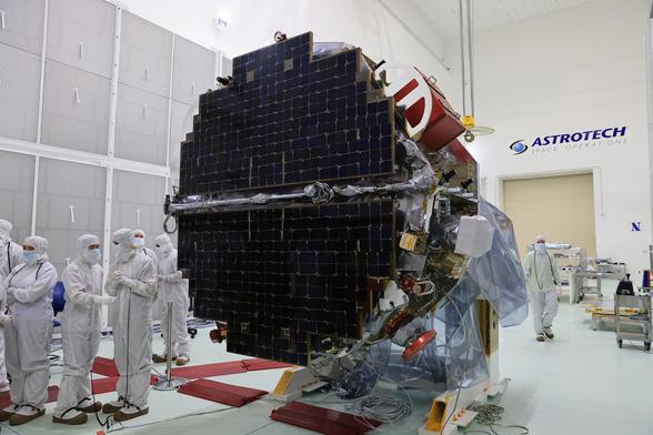 Technicians at the Astrotech Space Operations Facility near NASA’s Kennedy Space Center in Florida conduct illumination testing on Friday, July 18, 2025, by flashing a bright light that simulates the Sun into the two-panel solar array that will help power the agency’s IMAP (Interstellar Mapping and Acceleration Probe) observatory on its upcoming journey to a destination about one million miles away from Earth Lagrange Point 1.