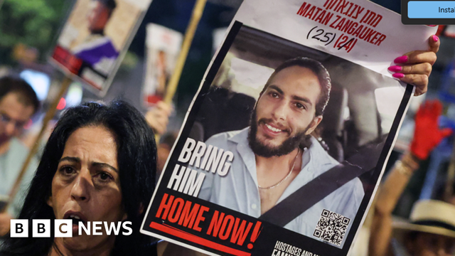 Enav Zangauker holds a portrait of her kidnapped son, Matan, during an anti-government protest calling for action to secure the release of Israeli hostages held captive in Gaza.