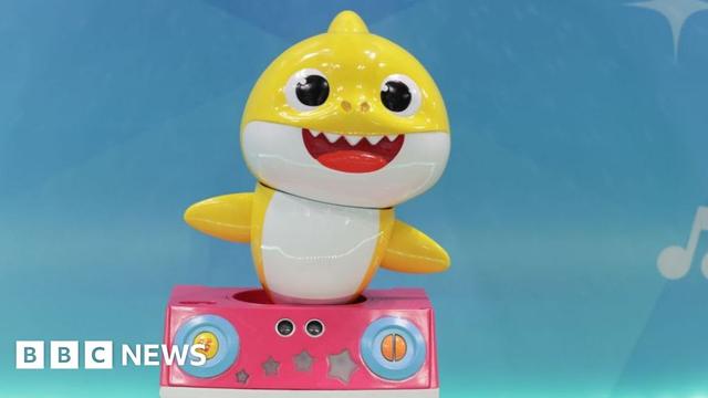 A yellow Baby Shark toy on display