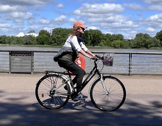 A person rides a bike along the Garonne river