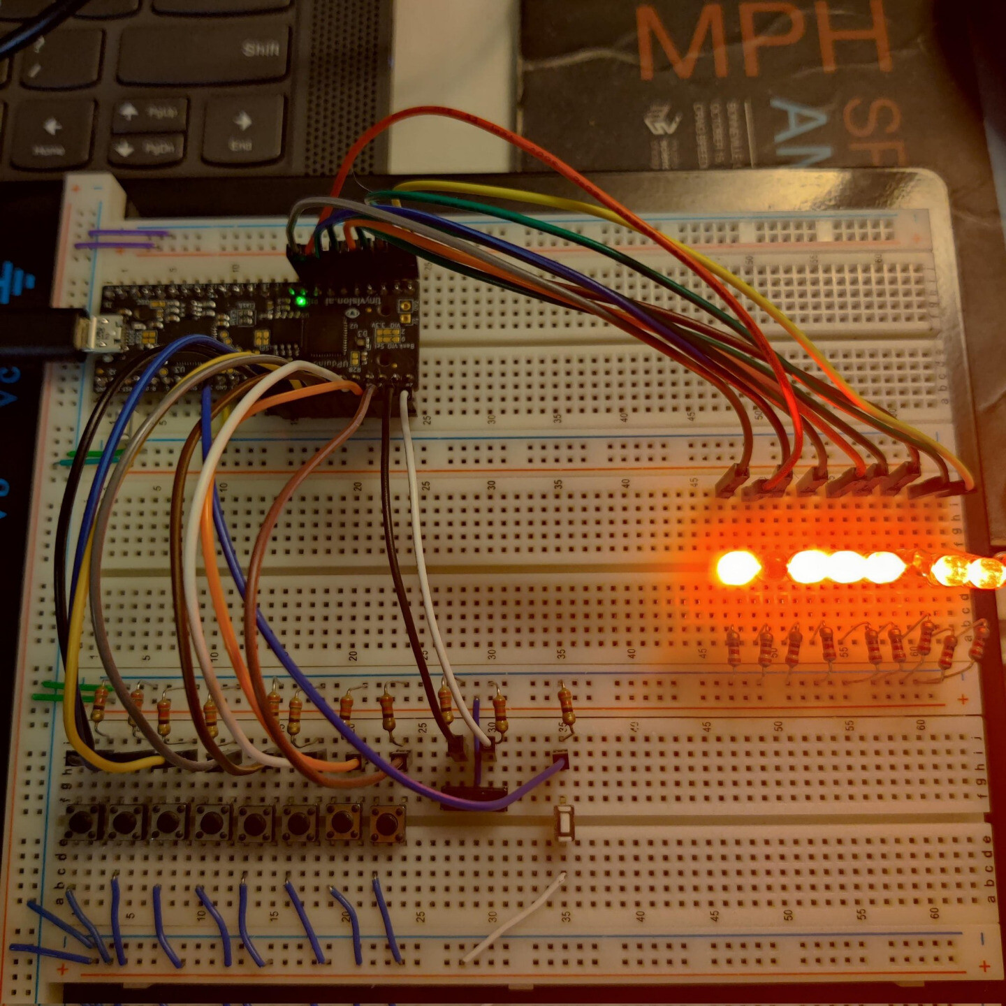 8-bit adder soon to become a part of a custom CPU. Assembled on a breadboard with a mess-o-wires and an UPduino 3.0 FPGA.