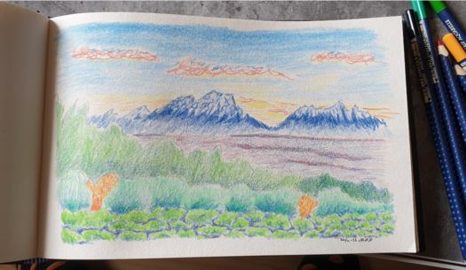 Colour sketch of a sunset against blue mountains.