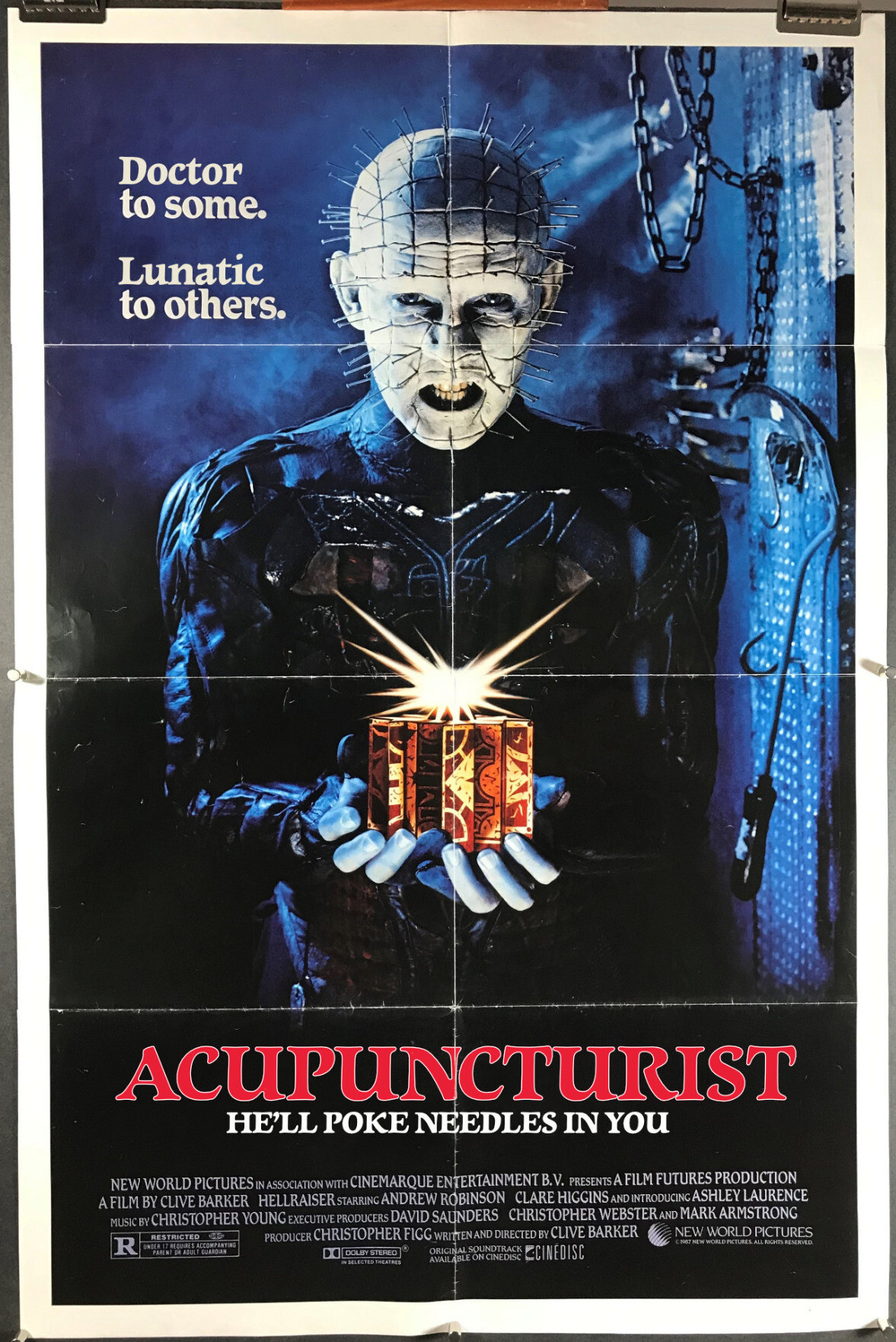 The classic Hellraiser poster, depicting the pin-headed cenobite, but the poster has been altered to be for ACUPUNCTURIST instead. There are two taglines:<br>Doctor to some. Lunatic to Others<br>&<br>He'll poke needles in you