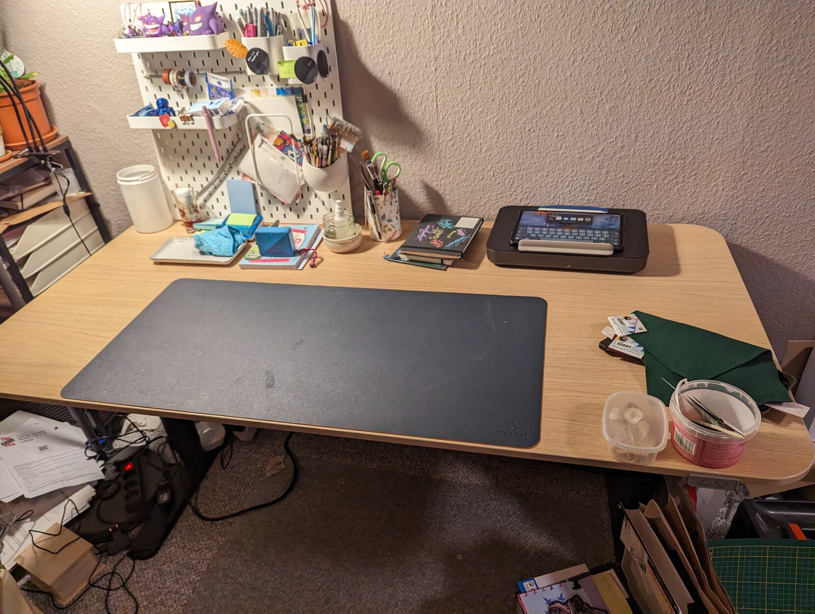 A cleaned up desk with much less stuff on it and the monitors gone. 