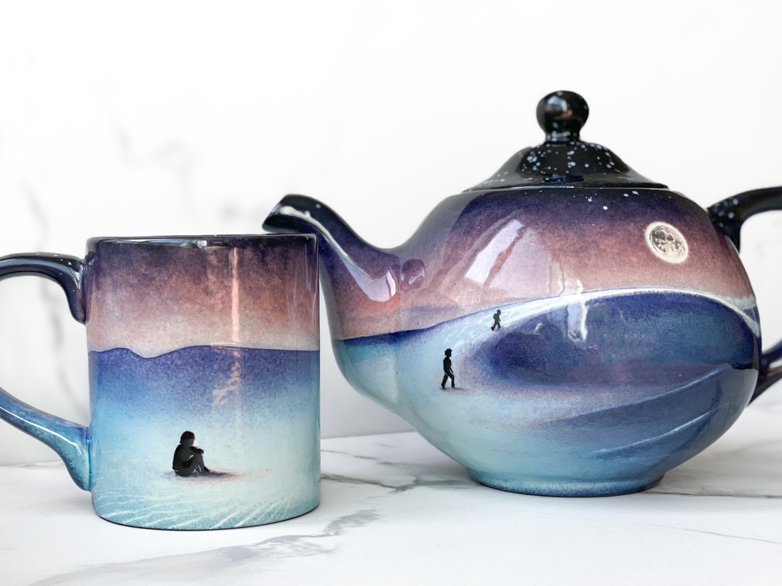 Teapot and mug featuring sand dune landscape under the Moon
