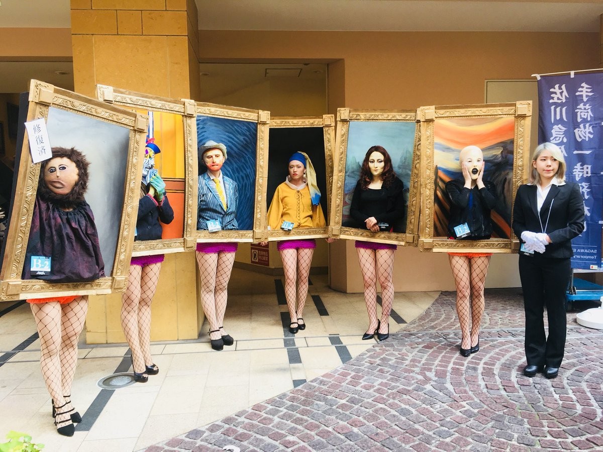 people wear costumes that look like famous framed portraits