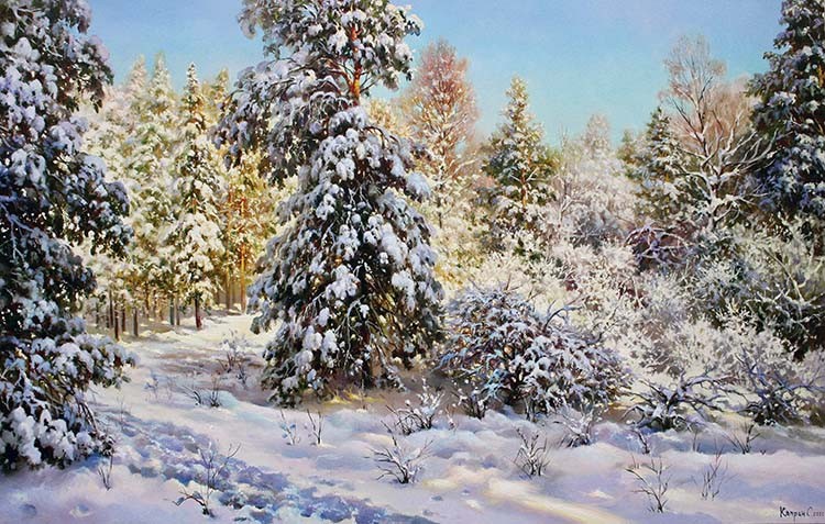 Winter forest landscape on a quiet sunny day with clear blue skies. Branches of pines and small bushes bent under the weight of the snow