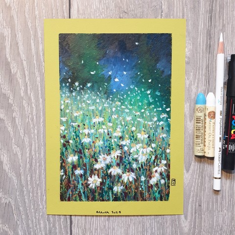 An oil pastel painting of a patch of daisies at light with light on them. 