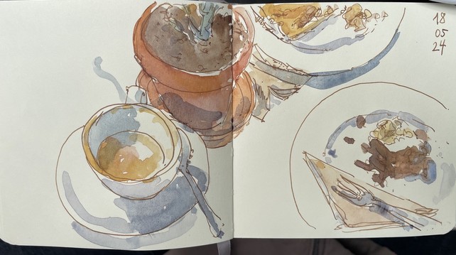 Brown ink and watercolor: sketch of a cup of coffee, two plates with food and a plant 
