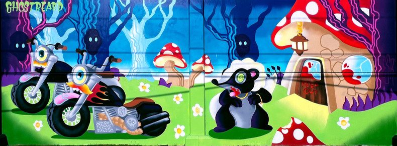 Murals of Islandview - Ghostbeard
Bright and colorful imagery of cute forest clearing environment. A skunk wearing gold chains is sticking its tongue out at 2 motorcycles, outside of a mushroom house. 