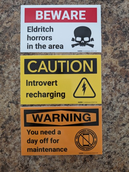 Three hazard labels on a counter. 