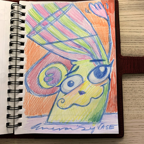 sketchbook in red leather case on pale wooden surface. sketch in colored pencil of a vase. the vase is somewhat abstract in appearance with a weary looking expression on their face. one hand is waving the other is curled at the side. the stems in the vase make a pink/green checkerboard. the rest of the image is multicolored.  bold signature, date, and 