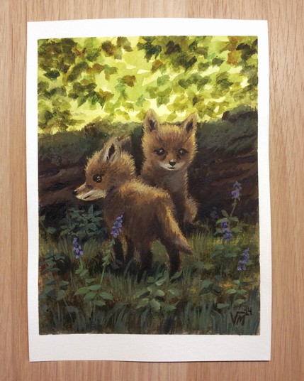 Watercolor and gouache painting of two fox cubs in a forest with wildflowers. By Victoria Maderna.