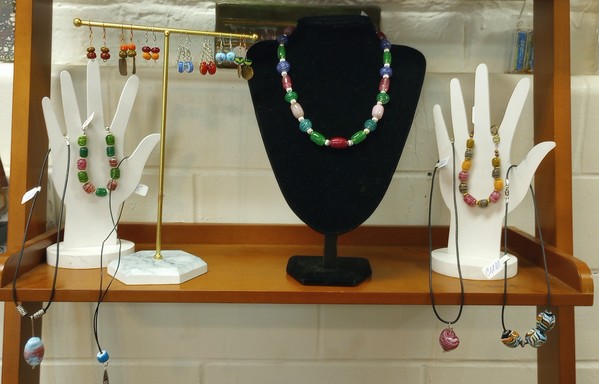 Necklace, pendants and bracelets featuring my handmade hot glass beads at the Athens Hot Glass shop in Athens Ohio.
