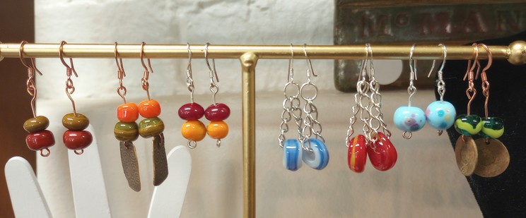 Earrings in copper and sterling silver featuring my glass beads at the Athens Hot Glass shop in Athens Ohio.