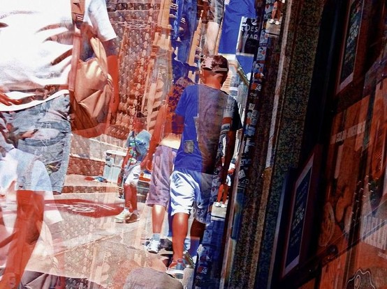 Barcelona digitally edited triple exposure street photography, made with the GNU Image Manipulation Program.