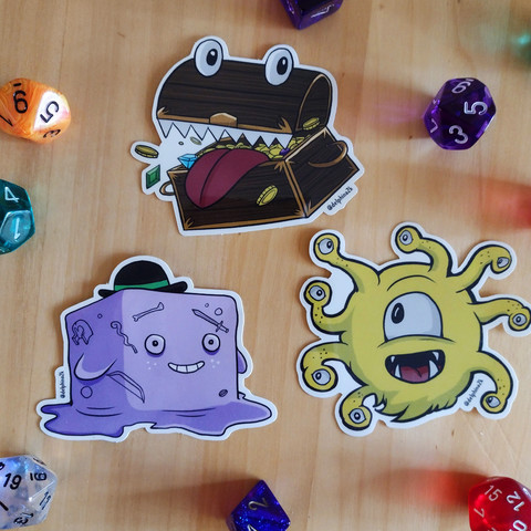Stickers of a cartoon mimic, beholder, and gelatinous cube