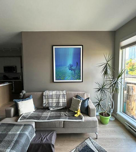 32-inch by 42-inch framed art centered on a living room wall.