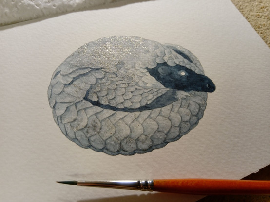 watercolor painting, a cute pangolin curled up in a ball. Its scales are light blue with gold sparkles.