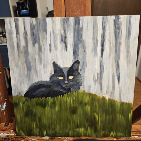 A work in progress oil painting of a black cat hiding behind bushes with an old fence in the background.