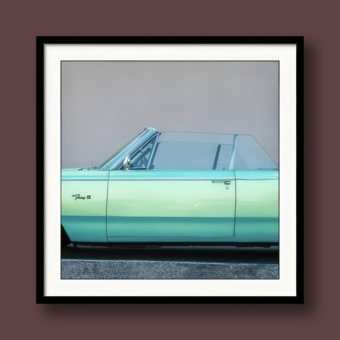 A cropped photo (framed and matted) by contemporary artist/photographer Jon Woodhams, depicting the midsection of a late-1960s Plymouth Fury III convertible in a soft aqua hue.