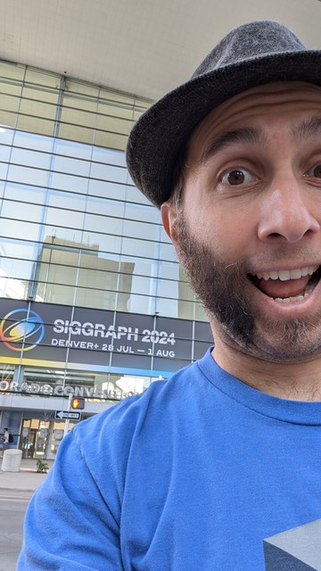 Goofy me in front of the SIGGRAPH banner