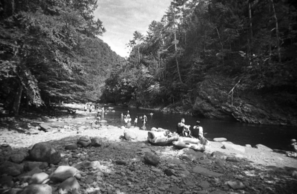 Black and white image of people swimming at the Townsend Wye - a popular spot along the Little River in the Tennessee Smokies.