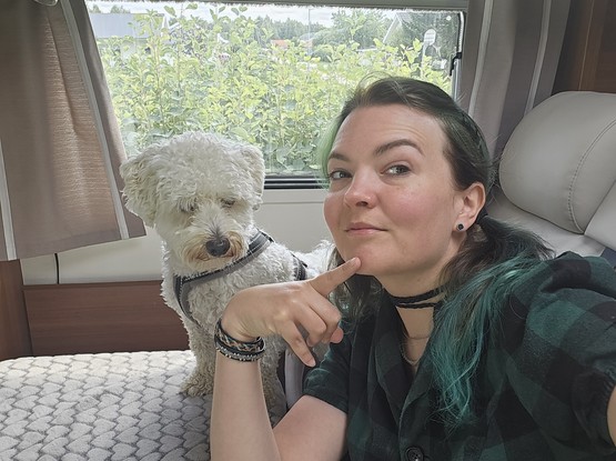 Dog and Jen doing a selfie in the mobile home