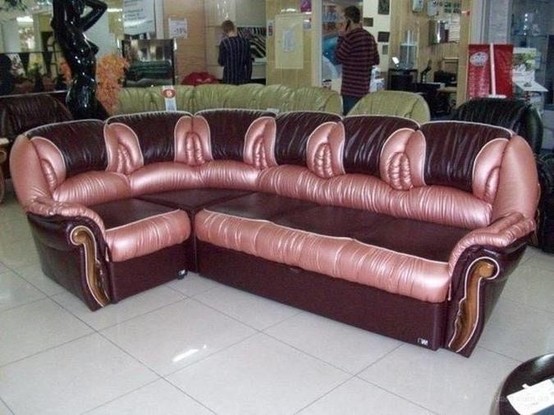 a leather couch that, no word of a lie, looks like it has *multiple* pussies on it