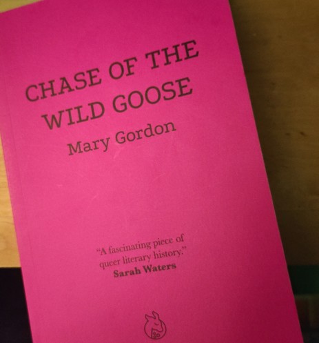 Copy of Chase of the Wild Goose by Mary Gordon. Black text on a magenta cover. Quote: 