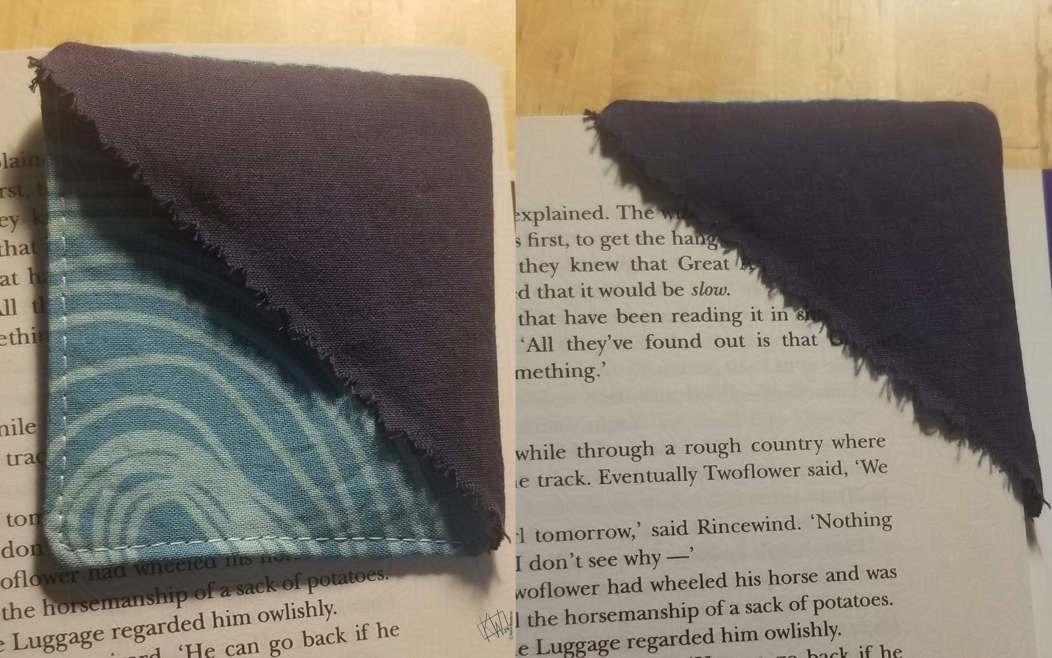 First photo: A pretty cloth bookmark made of a triangle of dark blue fabric sewn onto a square of light blue swirly fabric. Second photo: the same bookmark marking a page.